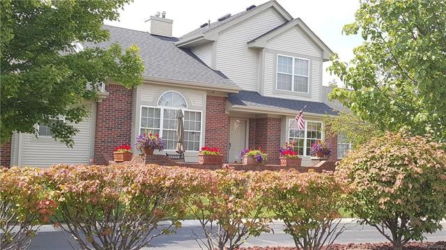 Front elevation with brick wall patio