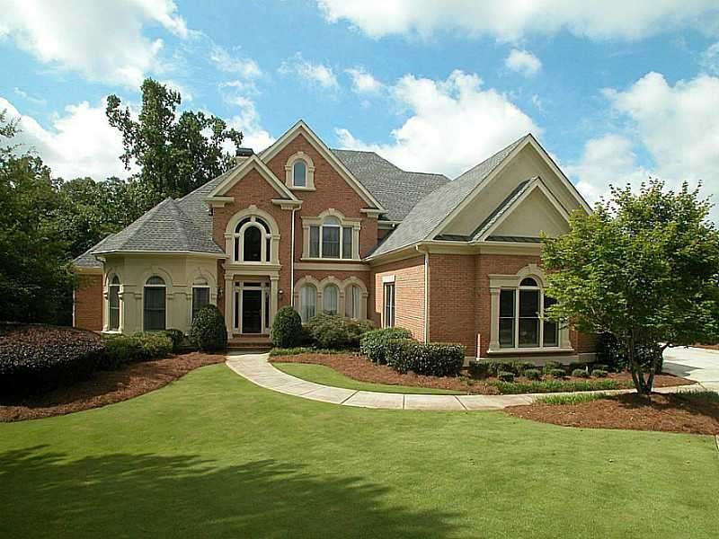 Exterior Front. Lovely brick home on level golf co