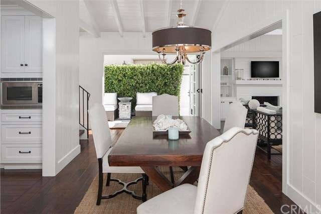 Modern and beachy, the dining area opens to the ki