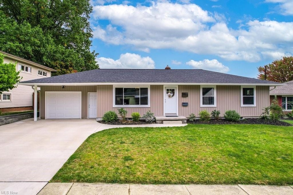 View of front of property with a garage and a fron