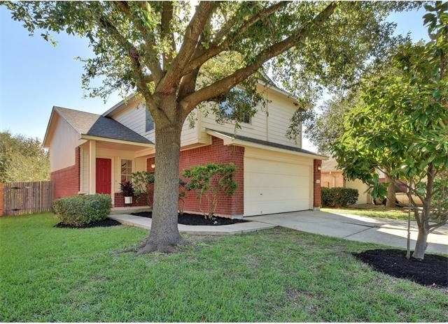 Adorable 2 story with large shade tree in front in