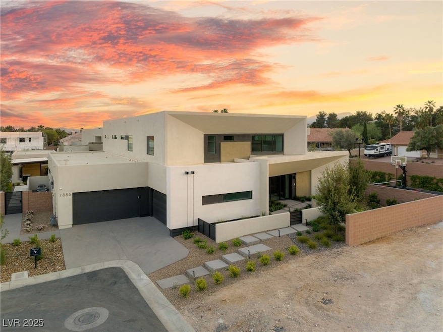 Modern home with stucco siding, concrete driveway, and a garage