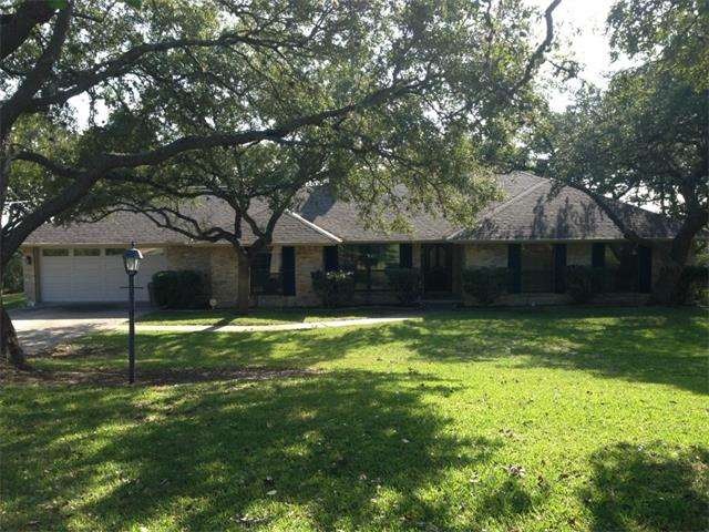 Stone home with new roof, nice front yard away fro