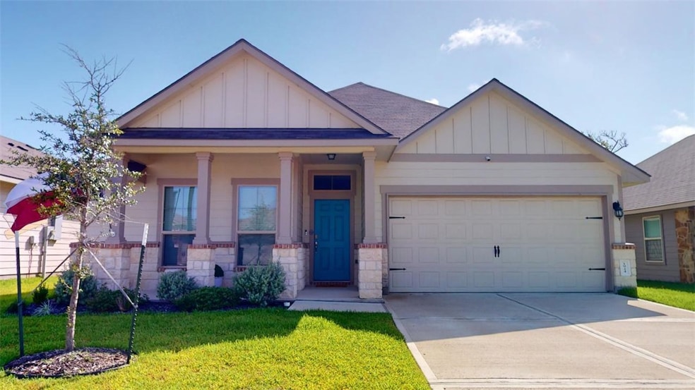 View of front of property with a front lawn, cover