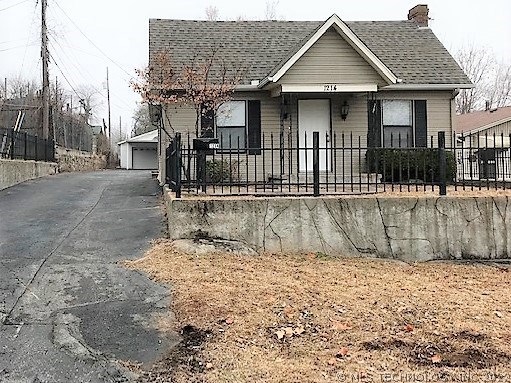 Front exterior with a 2-car detached garage direct