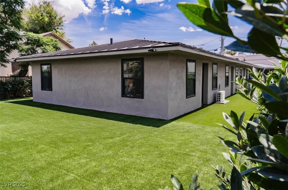 View of property exterior with stucco siding and a