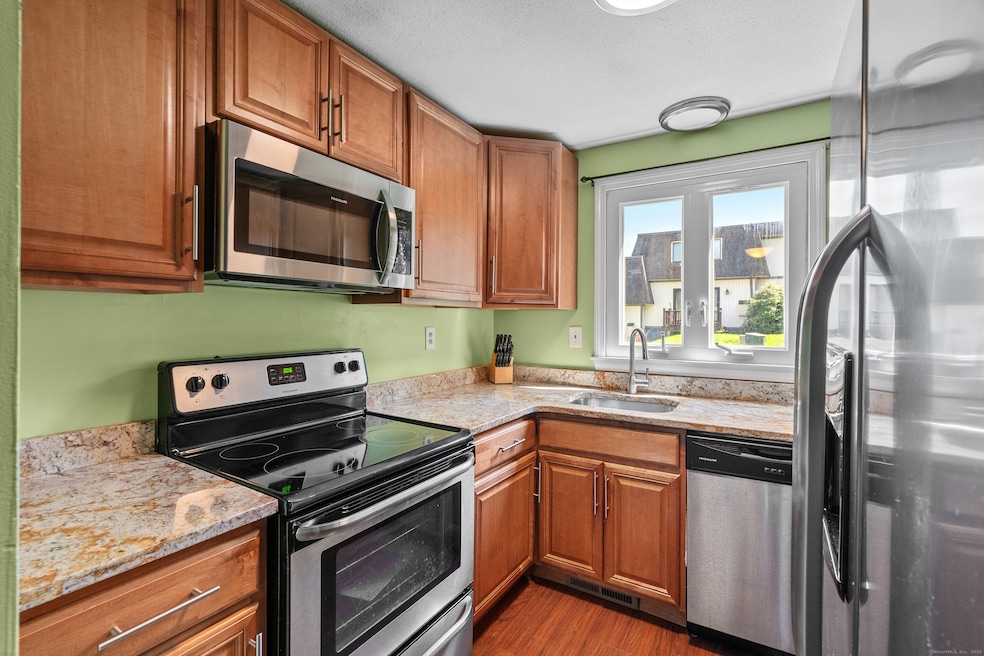 Pretty kitchen with granite counters and stainless
