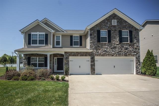 Handsome two-story beauty with a 3 car garage, dou