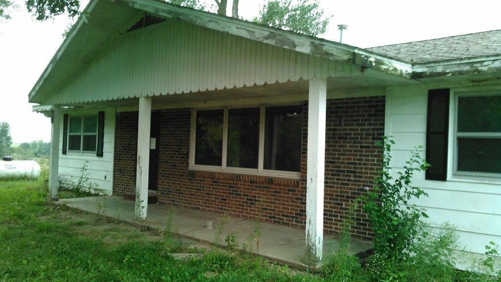 Entrance to home with covered porch.