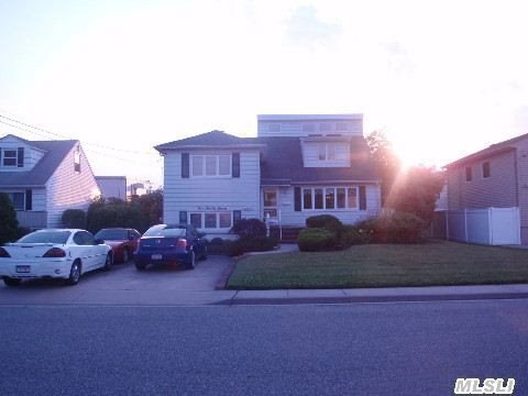 127 Mckinley Ave, Island Park, NY 11558 - photo 1