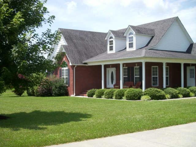 Beautiful all brick home with wrap-around porch