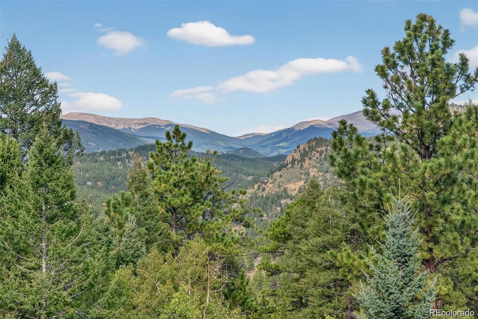 34611 Whispering Pines Trl in Pine with beautiful views of Mt Blue Sky (formerly Mt Evans) and Mt Rosalie