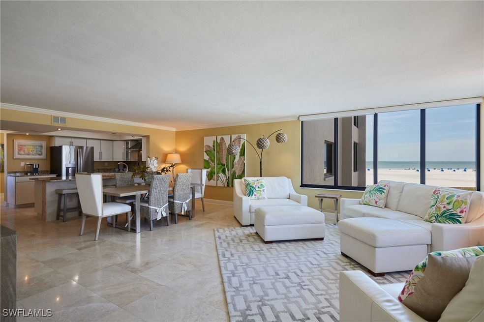 Living area with a water view, visible vents, and