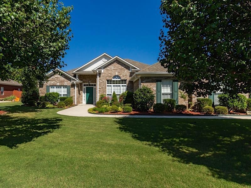 Beautifully landscaped yard with sprinkler system.