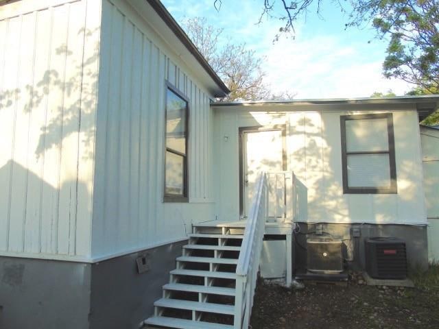 View of property exterior featuring central air c