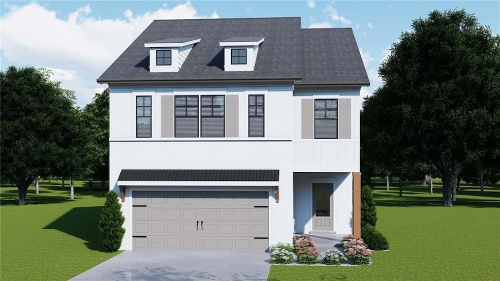 View of front of house featuring an attached garage, a front yard, concrete driveway, and brick siding