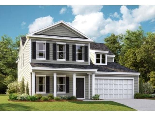 View of front of home featuring concrete driveway,