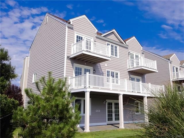 Exterior facing the yard and water