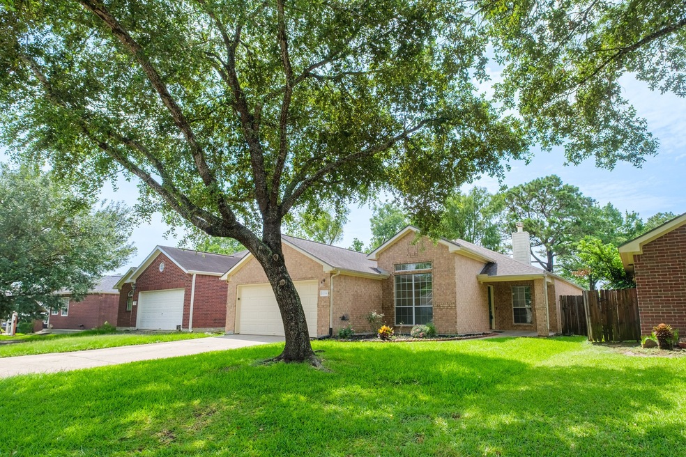 This charming single-story home features a brick e