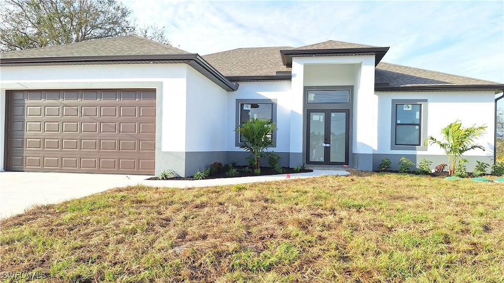 Prairie-style home with a garage, stucco siding, c