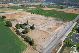 Birds eye view of property featuring a mountain view and a rural view