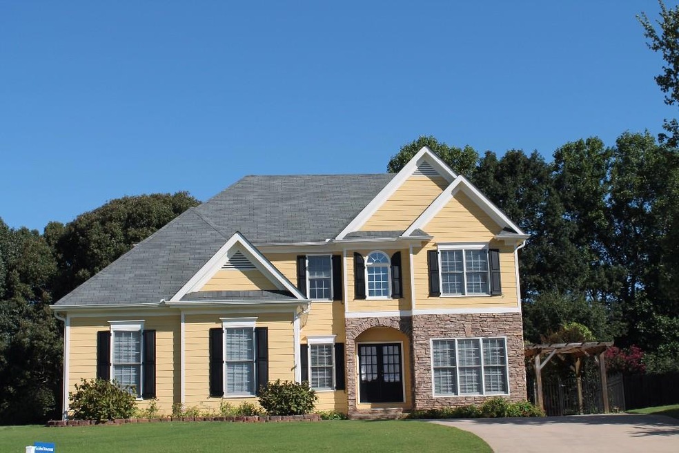 This charming home sits on over a half acre lot surrounded by large hardwoods.