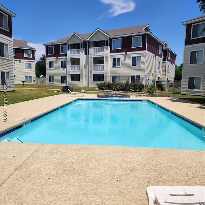 View of pool featuring a yard