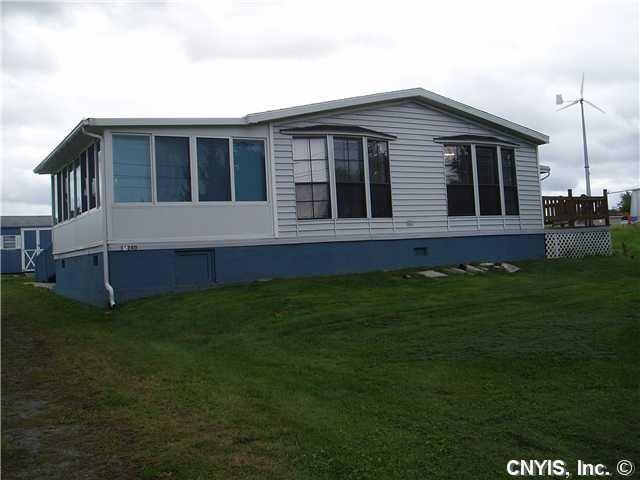 Exterior Front. Two additions provide extra space.