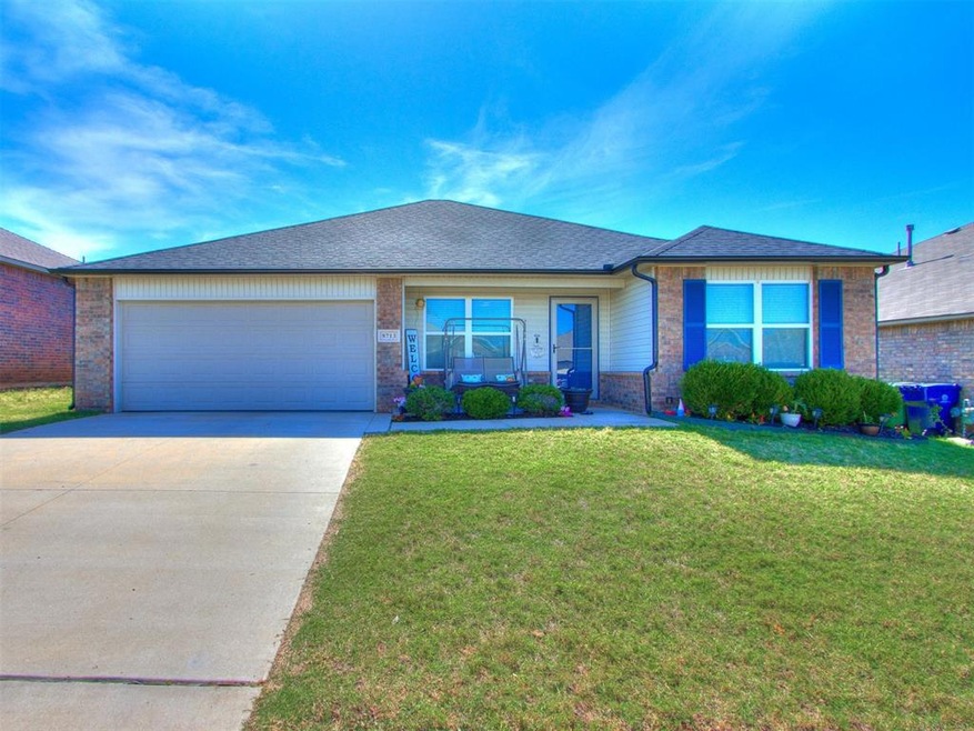 View of front of property featuring a garage, cove