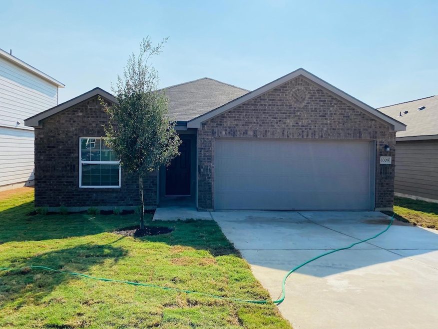 Ranch-style house with brick siding, concrete dri