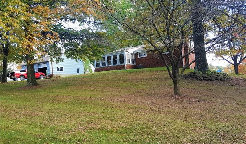 Brick Ranch with Large Garage on 1.76 acre.