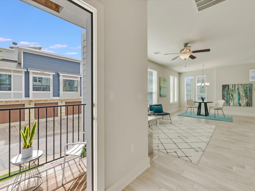 Sunroom featuring a chandelier