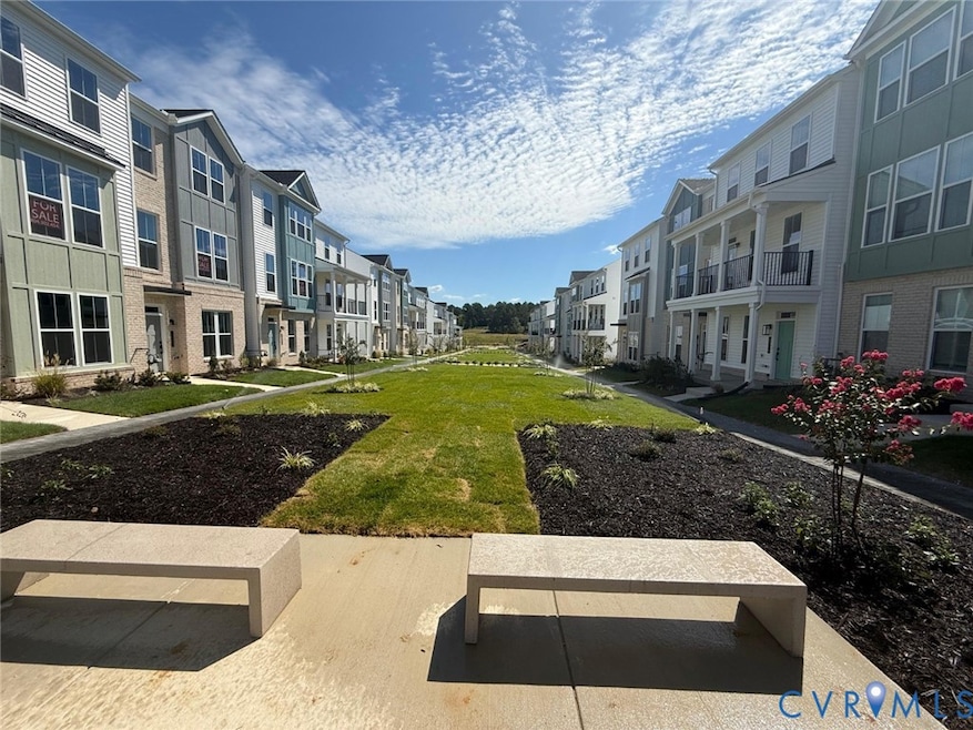Surrounding community featuring a lawn and a residential view