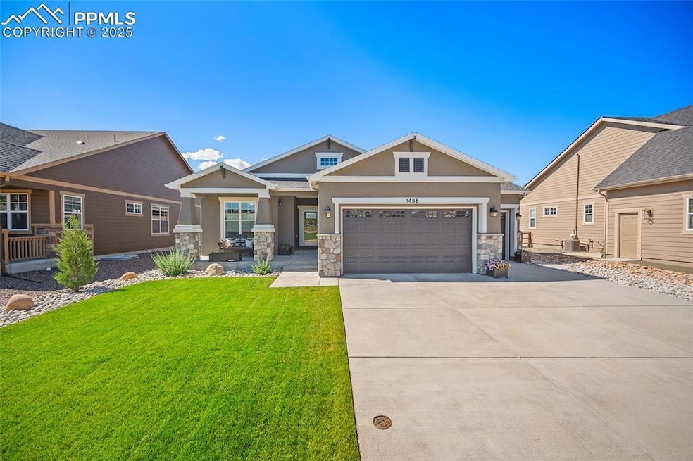 Craftsman inspired home featuring stucco siding, stone siding, concrete driveway, a front lawn, and a garage