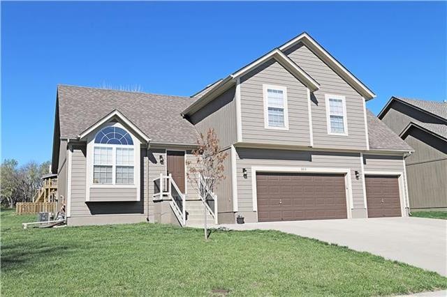Front of house with 3 car garage.