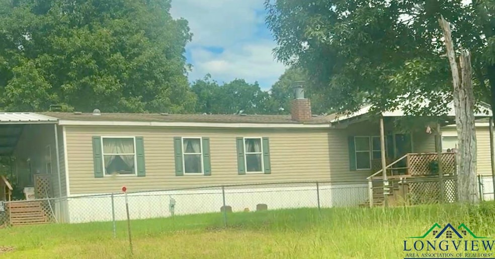 Back of property featuring a chimney