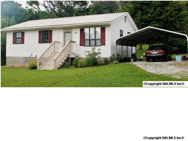 The vinyl siding extends over the facia boards, eves and soffits and a 4 year old metal roof means low maintenance and no painting will ever be needed for the exterior. The 2 car aluminum carport will keep you dry and your car protected from hail storms.