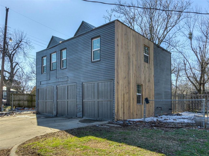 View of home's exterior featuring concrete driveway