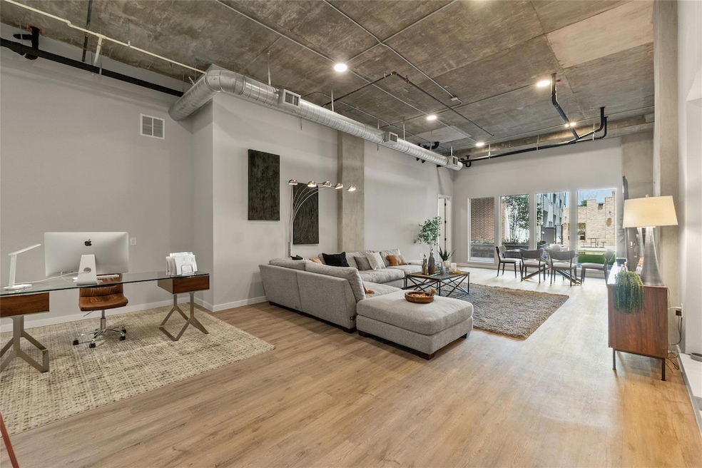 Living room featuring a high ceiling, wood finish