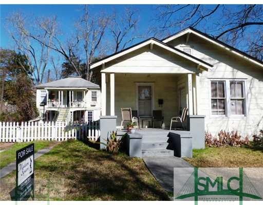 Exterior Front. Main house and carriage set back o