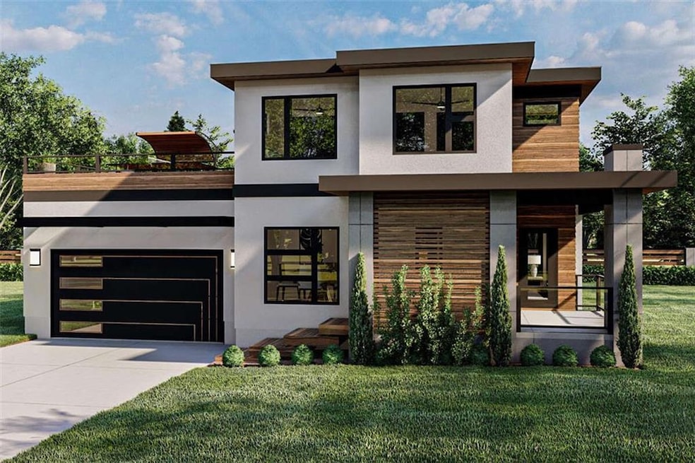 Contemporary house featuring a front yard and a ga