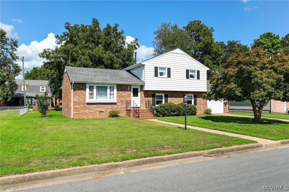 Tri-level home with a front yard