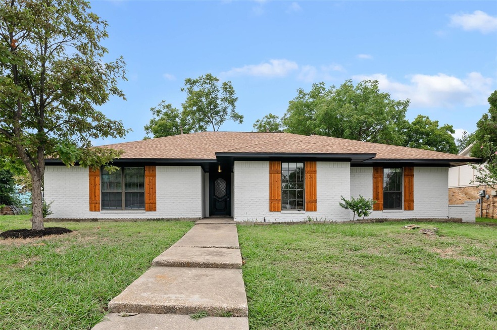 Single story home with a front lawn