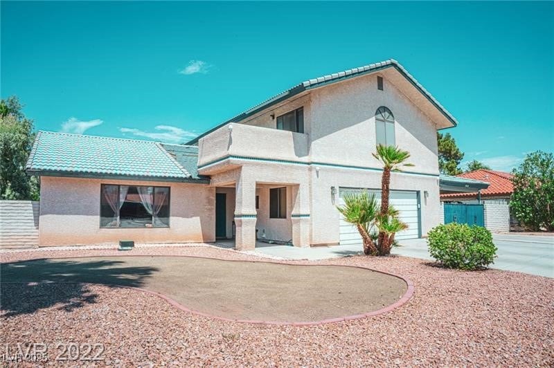View of front of property featuring stucco siding,
