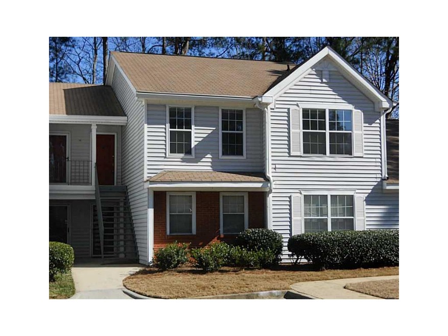 Exterior Front. Lush landscape.