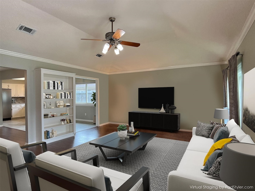 built-in bookshelves in living room, laminate wood flooring, HIGH vaulted ceiling