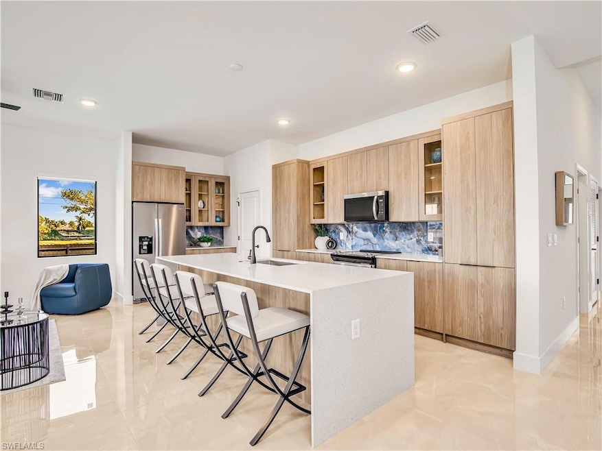 Kitchen featuring stainless steel appliances, mode