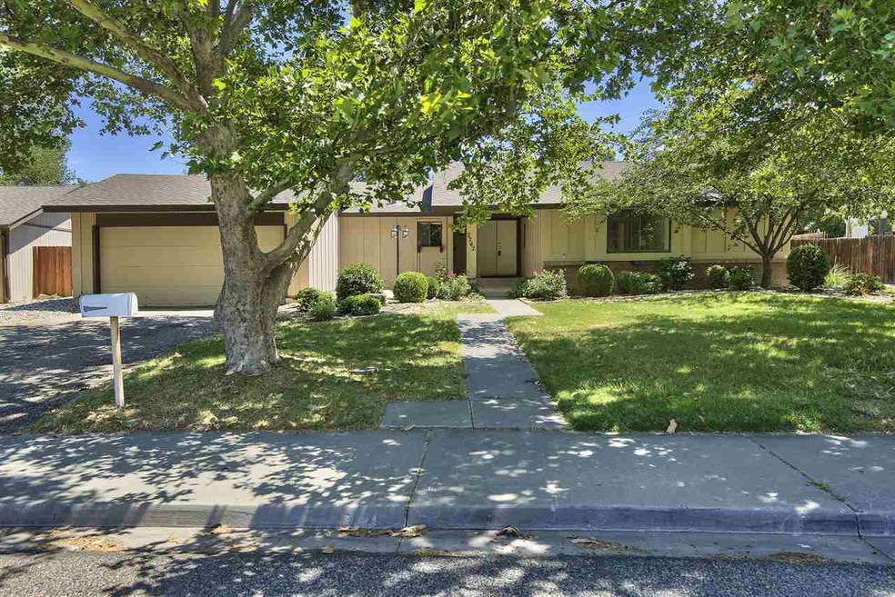 Call this 4-bedroom, 2-bathroom ranch style home y