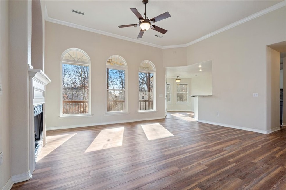  Beautiful windows made by Pella and Anderson fill the home with beautiful natural lighting.  Looking into Living Room and Kitchen from the Front Entry