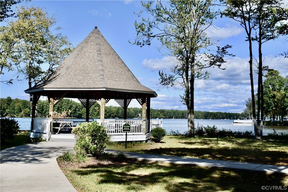 Surrounding community with a water view and a gaze
